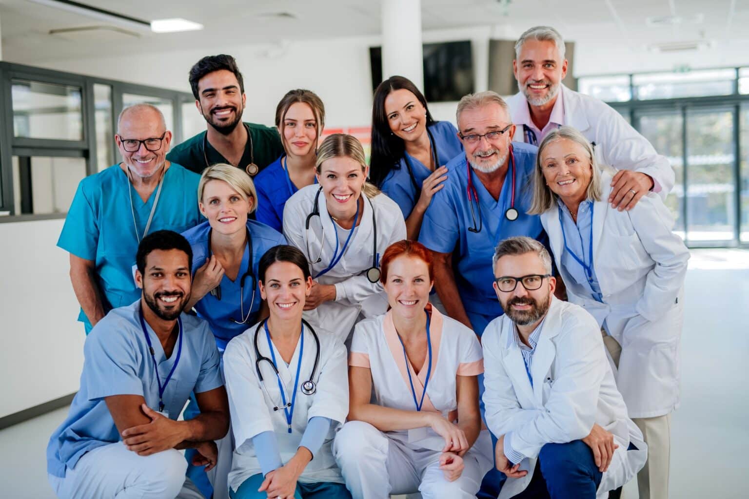 Portrait of happy doctors, nurses and other medical staff in hospital.