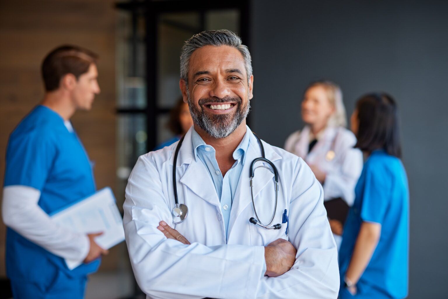 Portrait of smiling mixed race doctor in hospital
