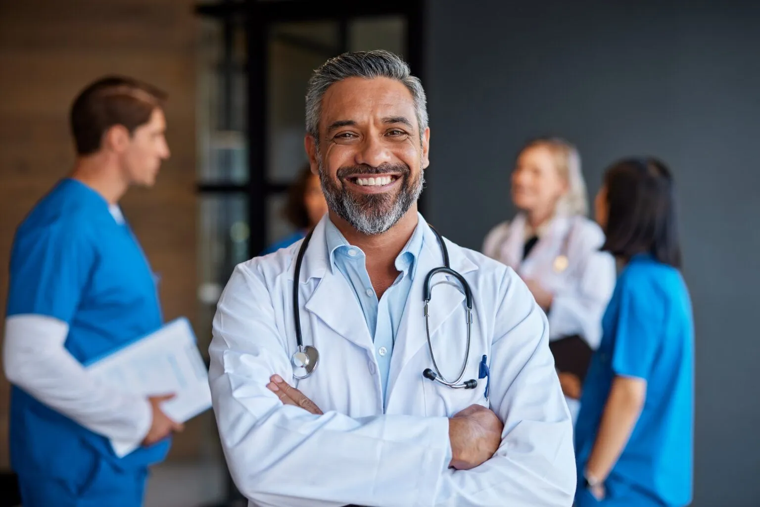 Portrait of smiling mixed race doctor in hospital
